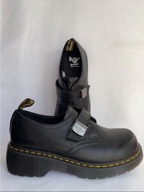 Dr. Martens womens
Black Leather Strap Platform Loafers with Yellow Stitching